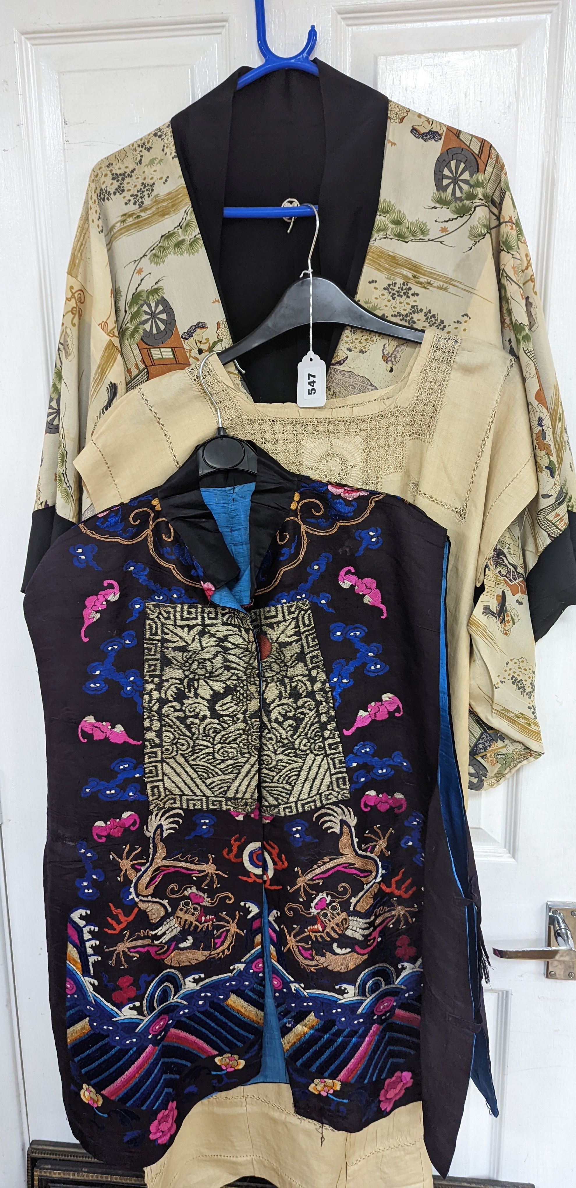 A 1920's Chinese dragon embroidered waistcoat, a cream silk drawn thread dress and a silk crepe black and patterned reversible kimono (3 items).